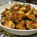 Succulent chicken thighs coated in golden honey garlic sauce.