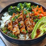 Juicy teriyaki chicken served over rice with an array of fresh vegetables.
