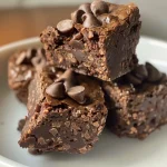 A texture shot highlighting the fudgy No Bake Brownie Bites with shiny chocolate glaze.