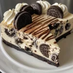 Close-up of a No Bake Oreo Cheesecake in a jelly jar topped with crushed Oreos.