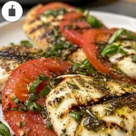 ['Juicy Air Fryer Caprese Chicken with melted mozzarella and fresh basil.', 'Deliciously plated Air Fryer chicken breasts topped with tomatoes and mozzarella.', 'Close-up view of Air Fryer Caprese Chicken garnished with balsamic drizzle.', 'Side view of succulent Caprese Chicken with fresh basil and vibrant colors.']