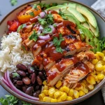 ['Close-up of a BBQ Chicken Rice Bowl with vibrant colors and textures.', 'Side view of a delicious rice bowl topped with BBQ chicken and garnishes.', 'Juicy BBQ Chicken Rice Bowl overflowing with colorful ingredients.', 'Detailed view of a rice bowl featuring BBQ chicken, cheese, and crispy onions.']