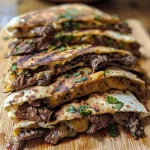 ['Close-up view of a Cajun steak quesadilla showing melted cheese and grilled steak.', 'Side angle of a delicious Cajun steak quesadilla filled with cheese, steak, mushrooms, and onions.', 'Juicy Cajun steak quesadilla with a golden-brown exterior and visible stuffing of cheese and vegetables.', 'Detailed shot of a Cajun steak quesadilla showcasing its hearty filling and crispy edges.']