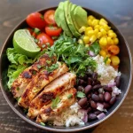 ['Close-up view of a Chicken Burrito Protein Bowl, showcasing vibrant ingredients.', 'Side view of a colorful Chicken Burrito Protein Bowl filled with various toppings.', 'Detailed image of a Chicken Burrito Protein Bowl highlighting chicken, vegetables, and rice.', 'Juicy Chicken Burrito Protein Bowl with fresh ingredients, viewed from the side.']