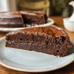 ['Close-up view of a decadent Chocolate Espresso Cake with glossy chocolate frosting.', 'Side view of a rich Chocolate Espresso Cake layered with dark chocolate icing and espresso drizzle.', 'A mouthwatering slice of Chocolate Espresso Cake showing moist layers and a creamy topping.', 'A detailed look at a Chocolate Espresso Cake adorned with chocolate shavings and espresso beans.']