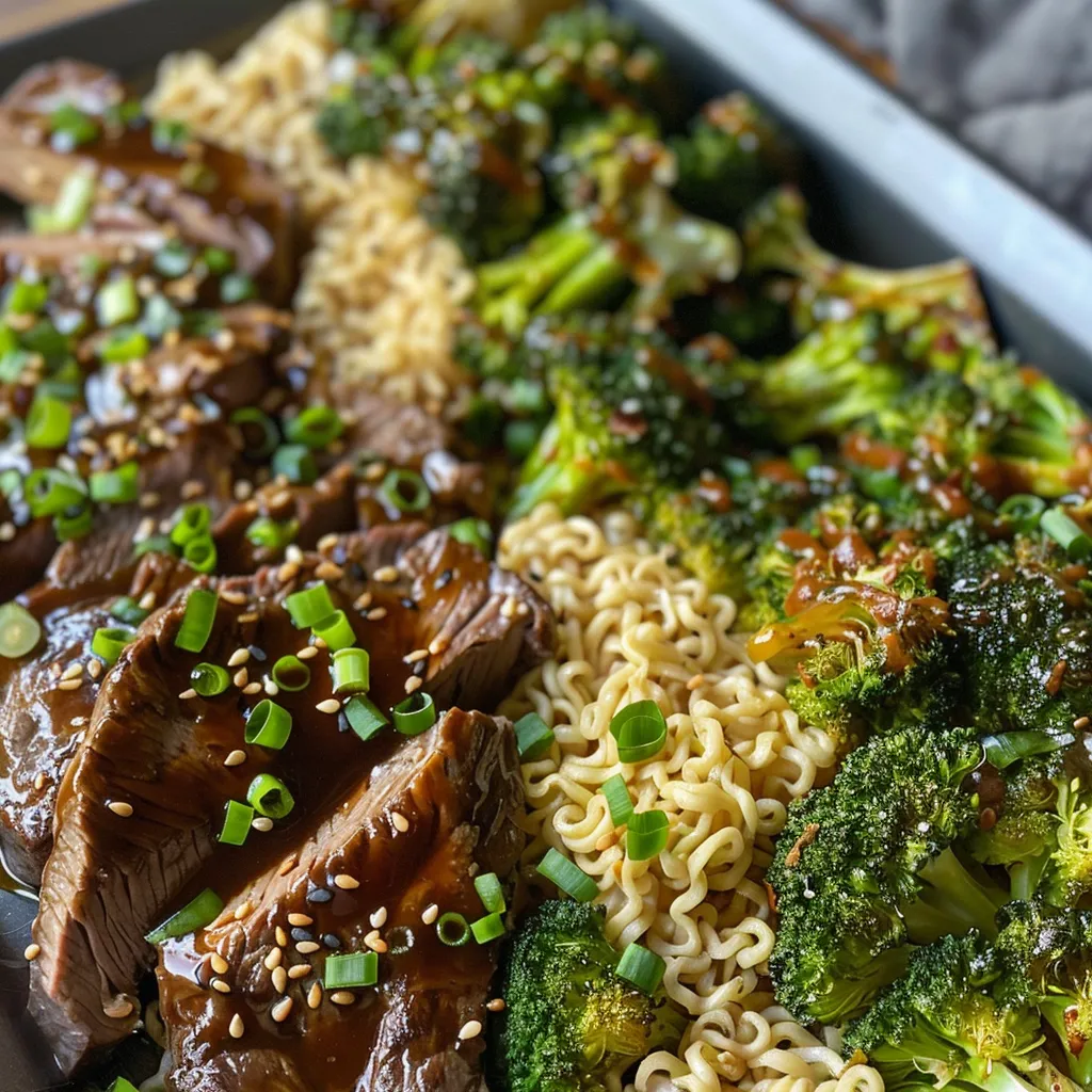 ['Close-up of a flavorful Sheet Pan Beef & Broccoli Ramen, showcasing tender beef and vibrant broccoli.', 'Side view of succulent Sheet Pan Beef & Broccoli Ramen arranged in a visually appealing manner.', 'A delicious plate of Sheet Pan Beef & Broccoli Ramen, featuring glazed beef and broccoli florets.', 'Colorful presentation of Sheet Pan Beef & Broccoli Ramen with fresh green onions as garnish.']