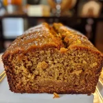 ['Close-up view of a slice of Pumpkin Chai Bread with a creamy frosting.', 'Side profile of a moist, golden-brown Pumpkin Chai Bread on a wooden cutting board.', 'Detailed image of Pumpkin Chai Bread showcasing its texture and spices.', 'Slice of Pumpkin Chai Bread with visible pumpkin and chai ingredients, captured with an iPhone.']